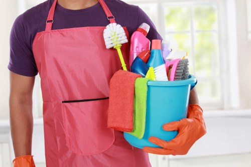 Office cleaner maintaining a neat workplace in Maidavale