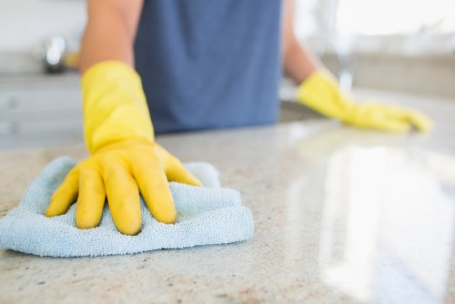 Technician using protective equipment during carpet cleaning